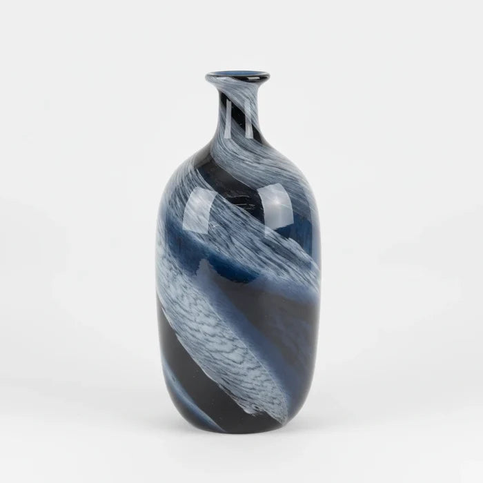 An elegant glass vase with a blue swirl design is centered on a clean white studio background with soft, even lighting and a subtle contact shadow.