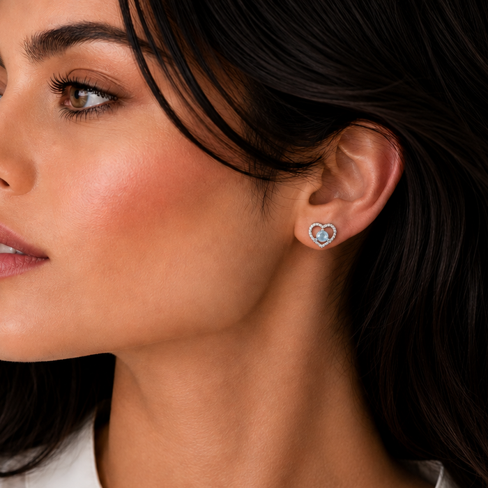 Rhodium Plated 925 Silver Twisted Heart Outline with Blue CZ Earrings - STE00111 | Silver Palace Inc.