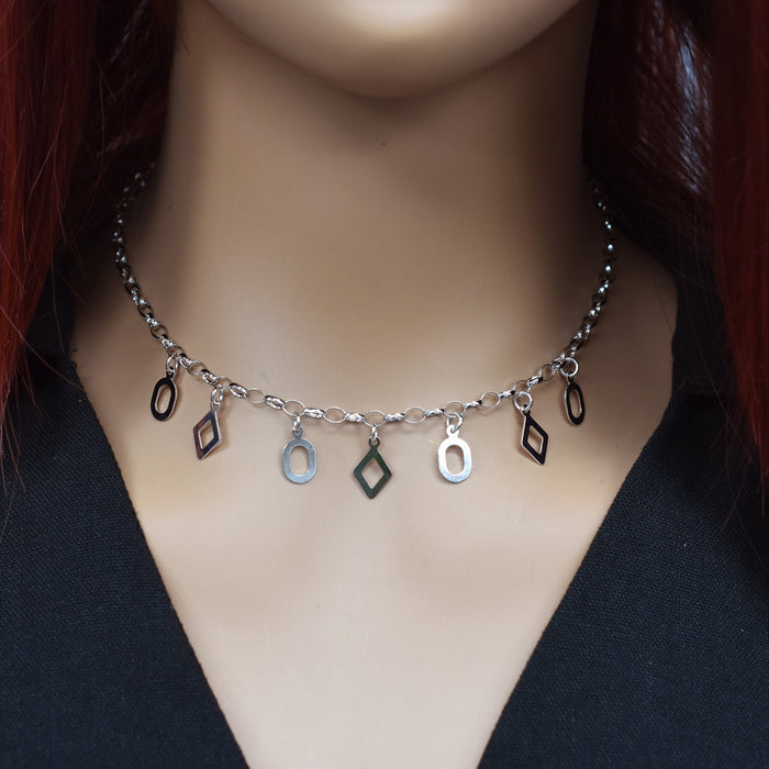 Rhodium Plated 925 Sterling Silver Oval and Diamond Cut Out Dangle Necklace - SPN00035