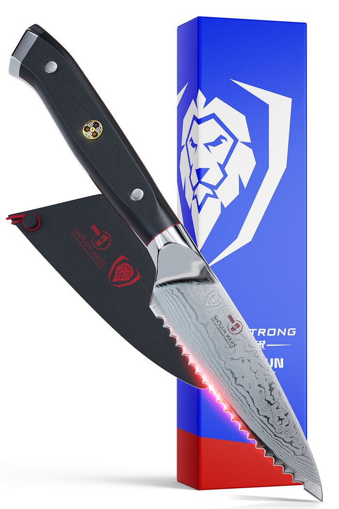 Dalstrong shogun series 3.5 inch serrated paring knife with black handle in front of it's premium packaging.