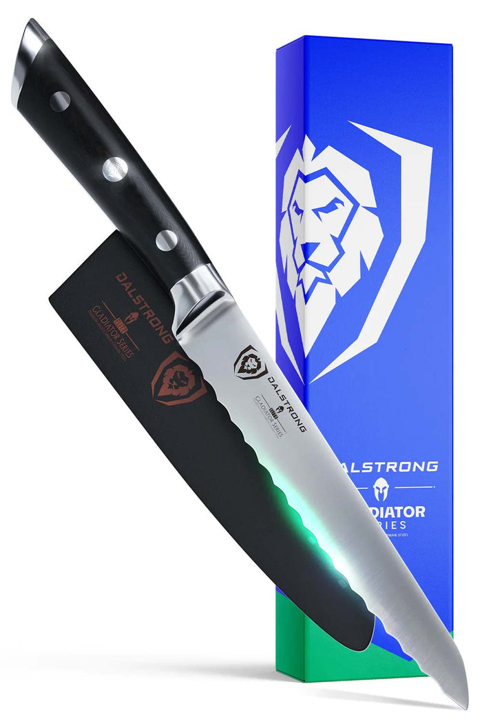 Dalstrong gladiator series 5.5 inch serrated utility knife with black handle in front of it's premiuim packaging.